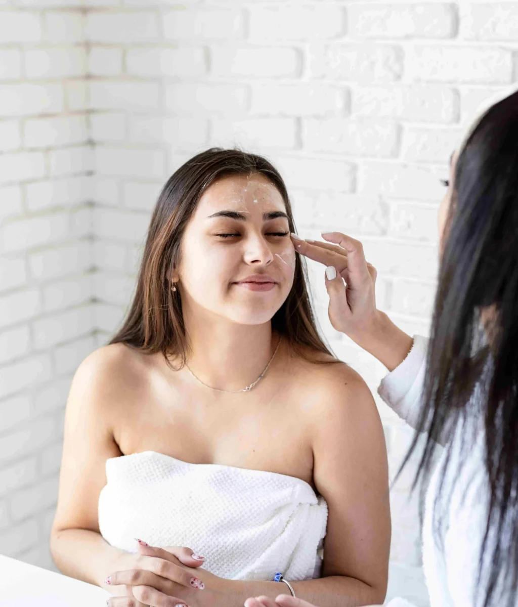 two-beautiful-women-applying-facial-cream-doing-sp-2023-11-27-04-51-41-utc-compressed